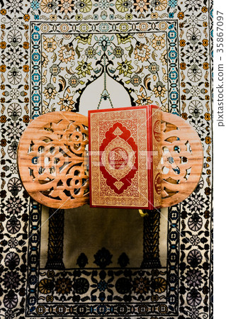 Koran - holy book of Muslims on the carpet Koran - holy book of Muslims on the carpet 35867097