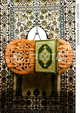 Koran - holy book of Muslims on the carpet 35867098