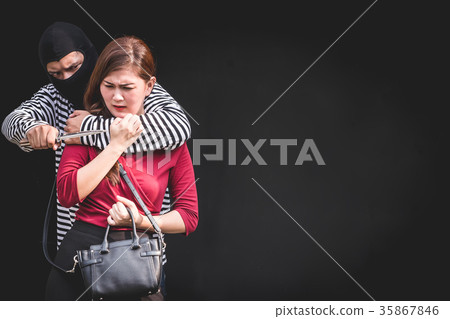 young woman scared while arrested by bandit. young woman scared while arrested by bandit. 35867846