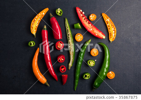 Colorful mix of chili pappers on black background. Colorful mix of chili pappers on black background. 35867875