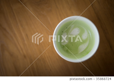 Hot green tea in paper cup 35868724