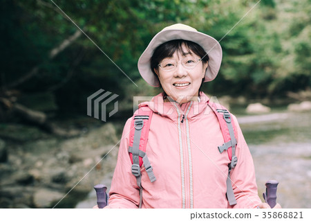 Senior woman outdoors climbing 35868821