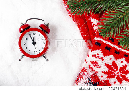 New Year's clock and scarf on snow. New Year's clock and scarf on snow. 35871834
