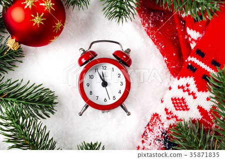Christmas background with clock and scarf on snow. Christmas background with clock and scarf on snow. 35871835