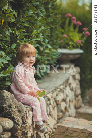 Baby cute girl with blond hair and pink apple chee Baby cute girl with blond hair and pink apple chee 35875842
