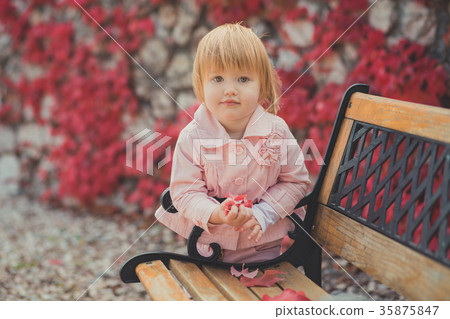 Baby cute girl with blond hair and pink apple chee Baby cute girl with blond hair and pink apple chee 35875847