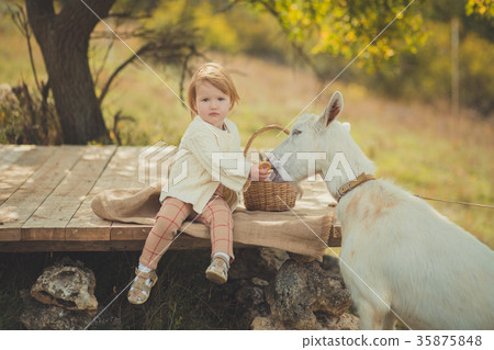 Baby cute girl with blond hair and pink apple chee Baby cute girl with blond hair and pink apple chee 35875848