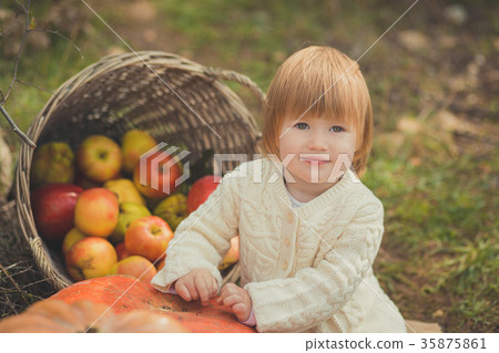 Baby cute girl with blond hair and pink apple chee Baby cute girl with blond hair and pink apple chee 35875861