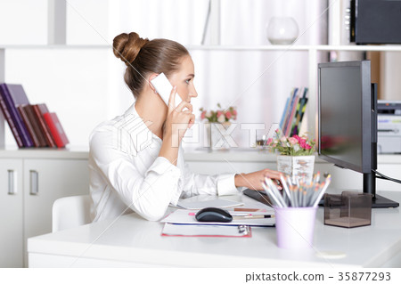 business woman talking on the phone business woman talking on the phone 35877293