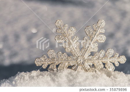 decorative snowflake sticking out of the snow decorative snowflake sticking out of the snow 35879896