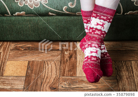 female legs in Christmas socks female legs in Christmas socks 35879898