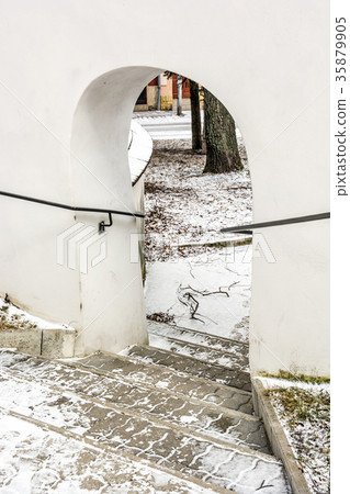 Shallow stairs and an historic gate with railing Shallow stairs and an historic gate with railing 35879905