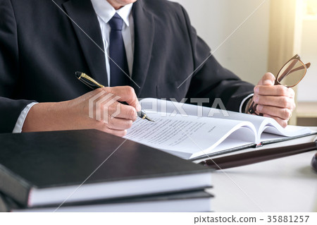 Male lawyer or judge working with Law books, gavel, report the c 35881257