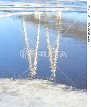 Reflection of cable stayed bridge at winter. 35882420
