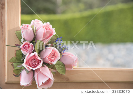 Artificial flower a natural background blurred. Artificial flower a natural background blurred. 35883070