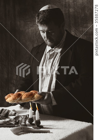 Heap of sweet round sabbath challah bread with 35887278