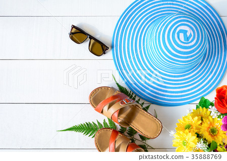 Blue hat sunglasses and shoe on white wood table Blue hat sunglasses and shoe on white wood table 35888769