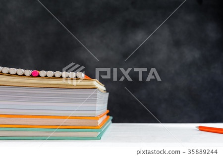book and pencil on white table black board book and pencil on white table black board 35889244