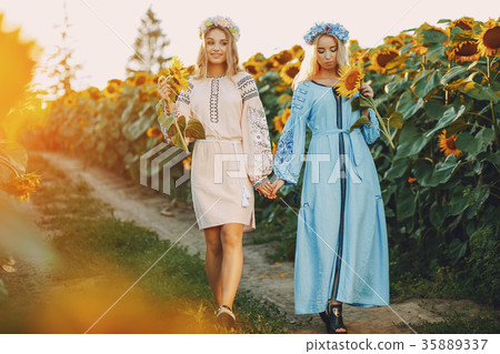 girls and sunflowers 35889337