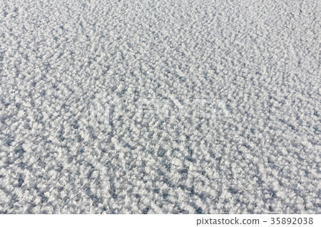 Rime on the ice of the freezing river 35892038