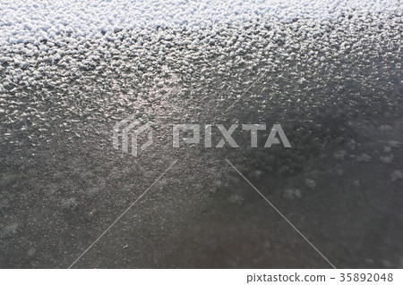 Rime on the ice of the freezing river 35892048