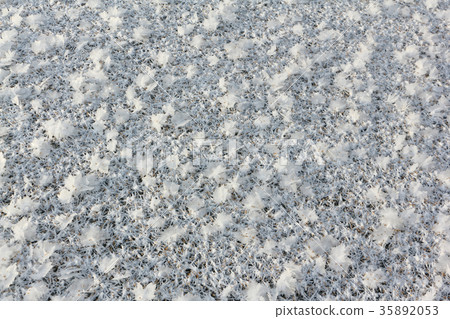 Rime on the ice of the freezing river 35892053