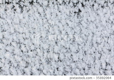 Rime on the ice of the freezing river 35892064