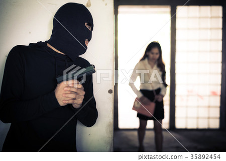 Robber holding up and waiting woman to steal her wallet or hand Robber holding up and waiting woman to steal her wallet or hand 35892454