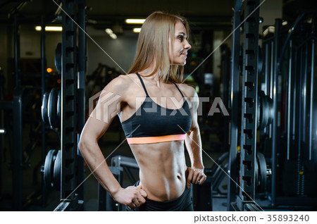 Sexy athletic young girl working out in gym 35893240