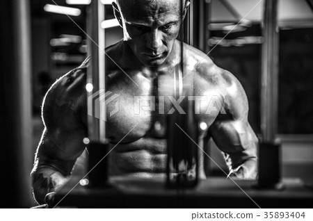 Handsome model young man posing in gym 35893404