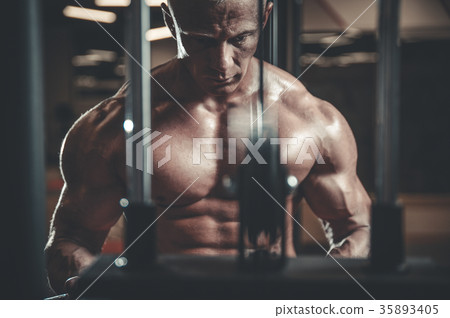 Handsome model young man posing in gym 35893405