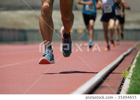 Athletics people running on the track field 35894655