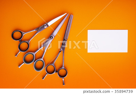 Hairdresser tools on color background  35894739