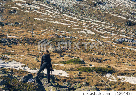 A woman photographer with camera in Switzerland 35895453