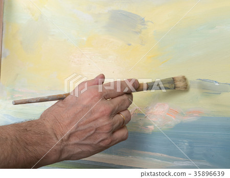 An artist painting in studio An artist painting in studio 35896639
