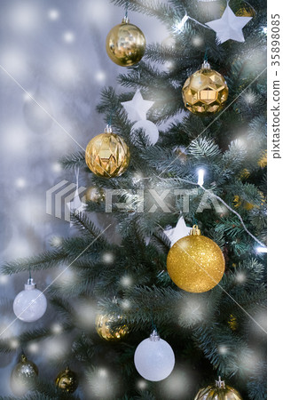 Decorated Christmas tree with star and gold ball  35898085