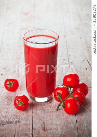 tomato juice in glass and fresh tomatoes 35902279