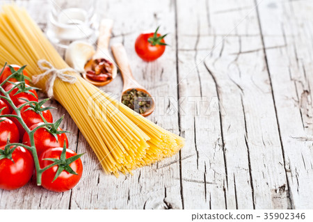 uncooked pasta with tomatoes and spices uncooked pasta with tomatoes and spices 35902346