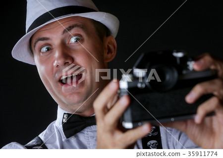 Young stylish man taking selfportrait Young stylish man taking selfportrait 35911774