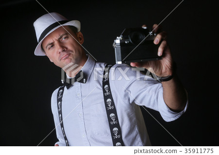 Young stylish man taking selfportrait Young stylish man taking selfportrait 35911775