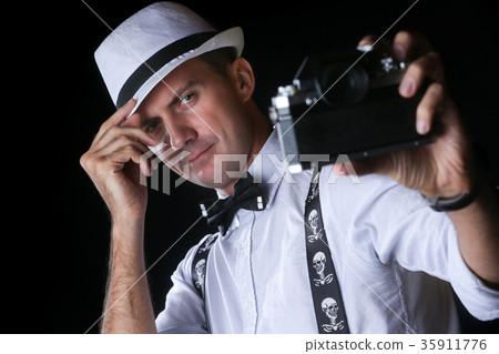 Young stylish man taking selfportrait Young stylish man taking selfportrait 35911776