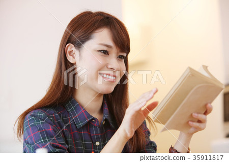 A woman reading A woman reading 35911817