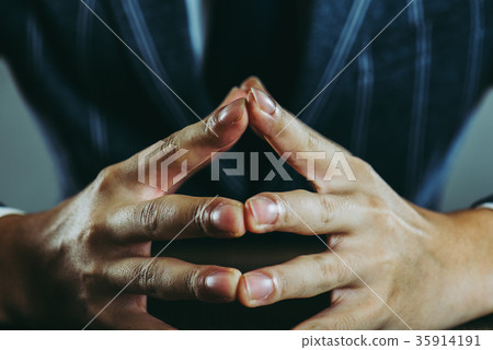 Businessman hand close up studio shot 35914191