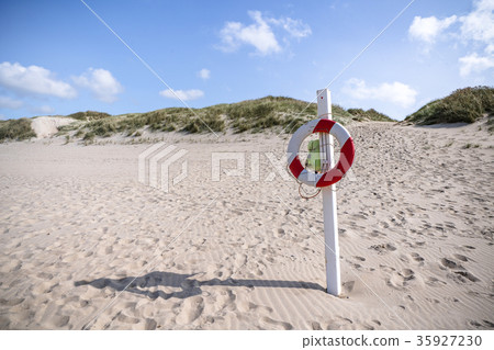 Lifesaver hanging on a post Lifesaver hanging on a post 35927230