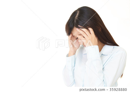 A woman with a depressed face 35928880