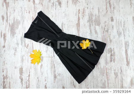 Little black dress and maple leaves 35929164