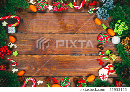 Christmas frame with Christmas tree branches Christmas frame with Christmas tree branches 35933133