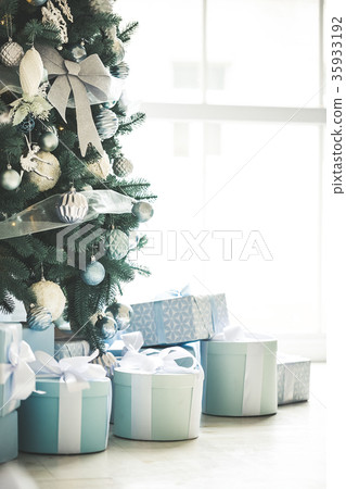 Christmas living room with a Christmas tree, gifts Christmas living room with a Christmas tree, gifts 35933192