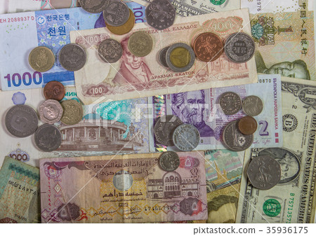Colorful background of many currency banknotes. Colorful background of many currency banknotes. 35936175