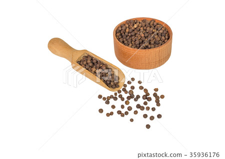 allspice in a wooden bowl. Black pepper. isolated allspice in a wooden bowl. Black pepper. isolated 35936176